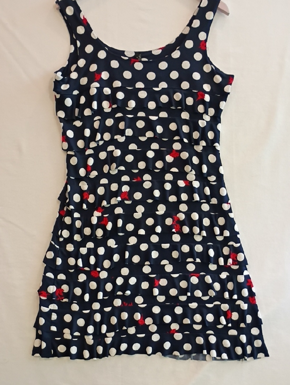 Navy Polka Dot Sleeveless Ruffle Dress with Red Accent